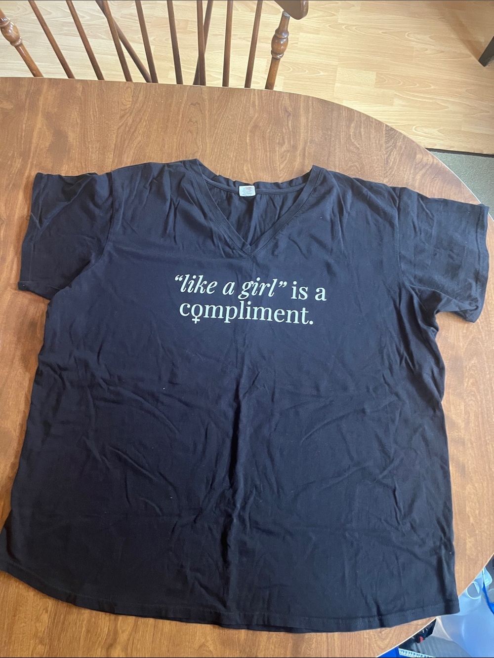 Sseko Black V‑Neck Tee with White Slogan